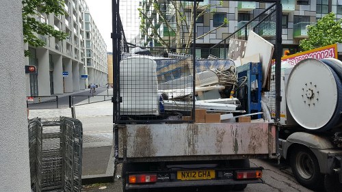 Staff assisting customers in Silvertown mattress store